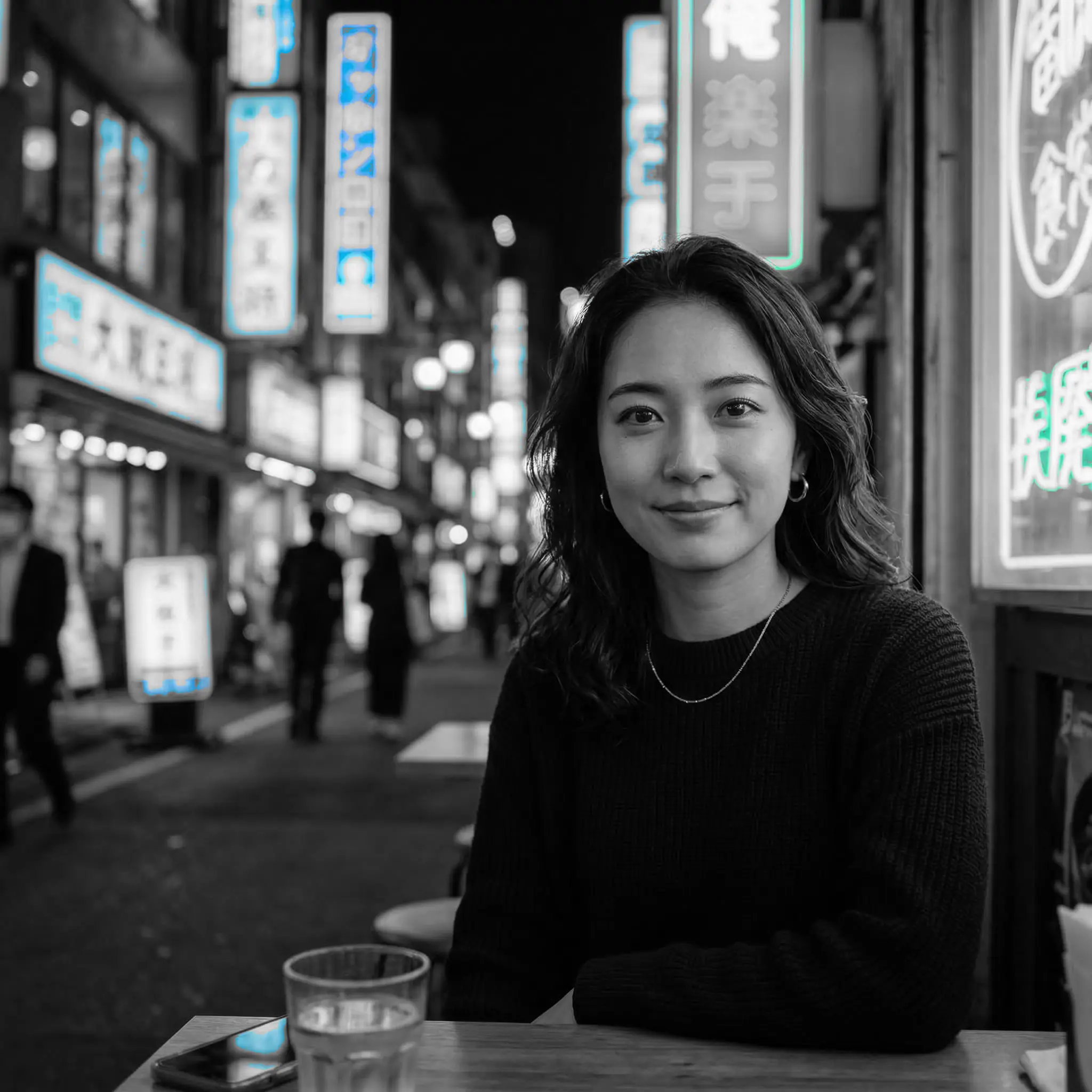 Night portrait with cyan neon signage preserved as the only strong color accent